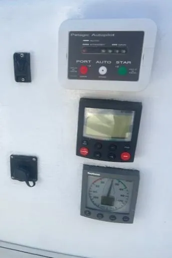 Slide: The Image of Control panel of 1980 Kaiser Gale Force 34 with autopilot and navigation instruments. - 23