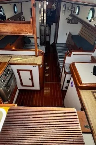 Slide: The Image of Interior of 1980 Kaiser Gale Force 34 sailboat with wood finishes and compact layout. - 25