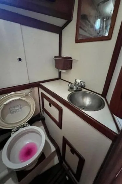 Slide: The Image of 1980 Kaiser Gale Force 34 yacht bathroom with sink and toilet. - 30
