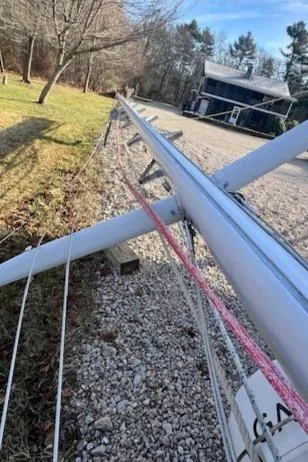 Slide: The Image of Mast of 1980 Kaiser Gale Force 34 sailboat lying on gravel path. - 32