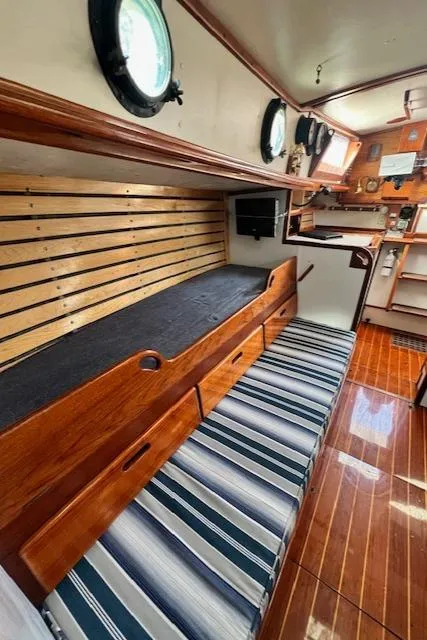 Slide: The Image of 1980 Kaiser Gale Force 34 interior with wooden finish and striped seating. - 38