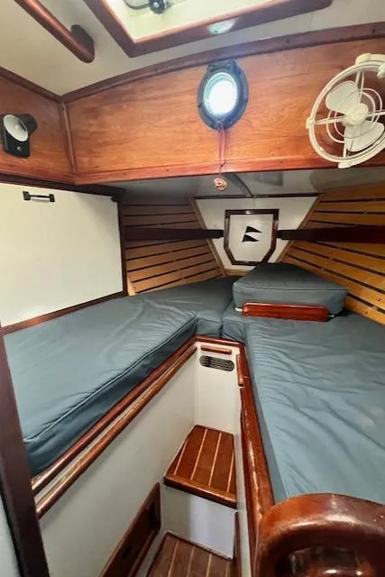 Slide: The Image of Cozy cabin interior of 1980 Kaiser Gale Force 34 sailboat with wooden accents. - 42