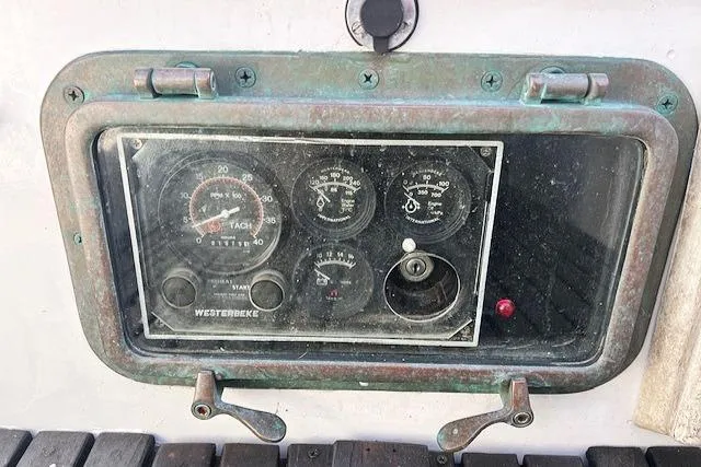 Slide: The Image of Control panel of a 1980 Kaiser Gale Force 34 boat with gauges and dials. - 44