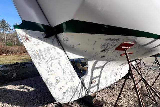 Slide: The Image of 1980 Kaiser Gale Force 34 sailboat hull on stands, undergoing maintenance. - 6