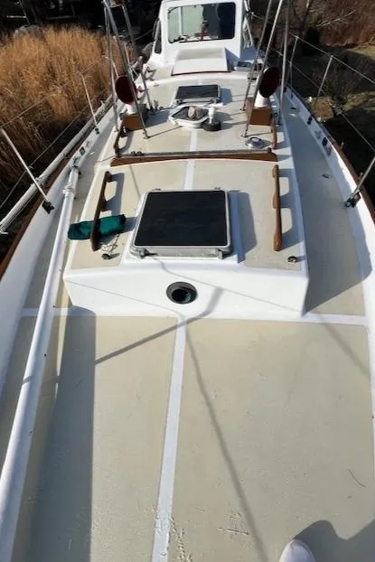 Slide: The Image of 1980 Kaiser Gale Force 34 sailboat deck with hatches and railing, viewed from above. - 9