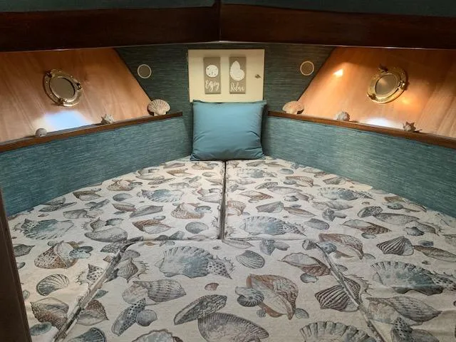 Slide: The Image of Cozy cabin interior of 1968 Chris-Craft 31 Commander with nautical decor. - 10