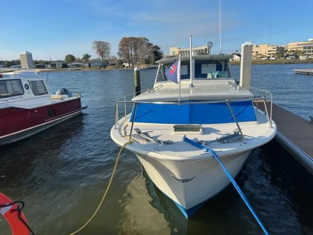 Slide: The Image of 1968 Chris-Craft 31 Commander docked on a sunny day. - 3