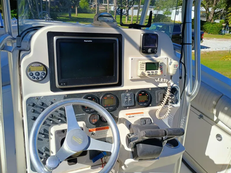 Slide: The Image of 2007 Hydra-Sports 2500CC Vector boat dashboard with steering wheel and navigation equipment. - 6
