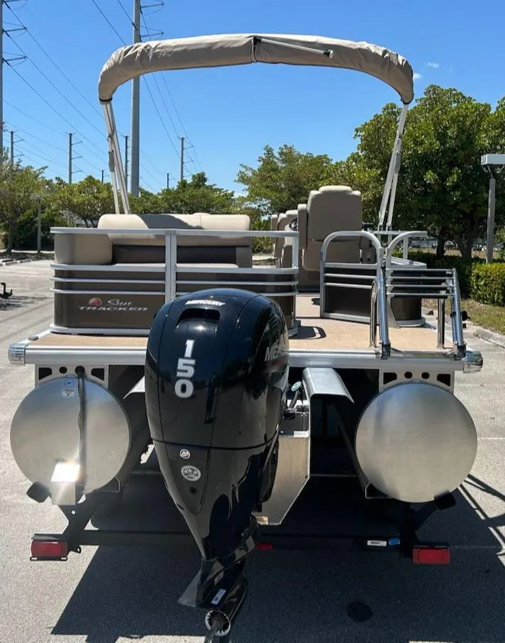 Slide: The Image of 2025 Sun Tracker Sportfish 24 XP3 pontoon boat with Mercury 150 engine. - 4