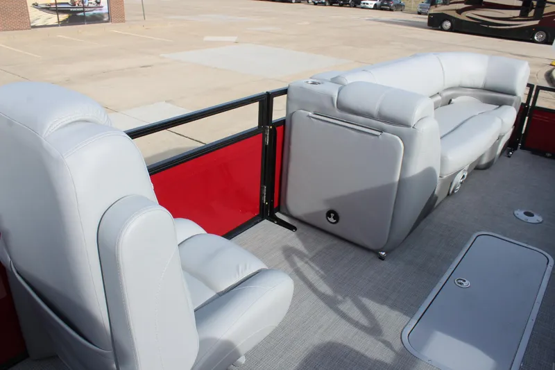 Slide: The Image of 2025 Regency 230 DL3 boat dashboard with Lowrance display and steering wheel. - 13