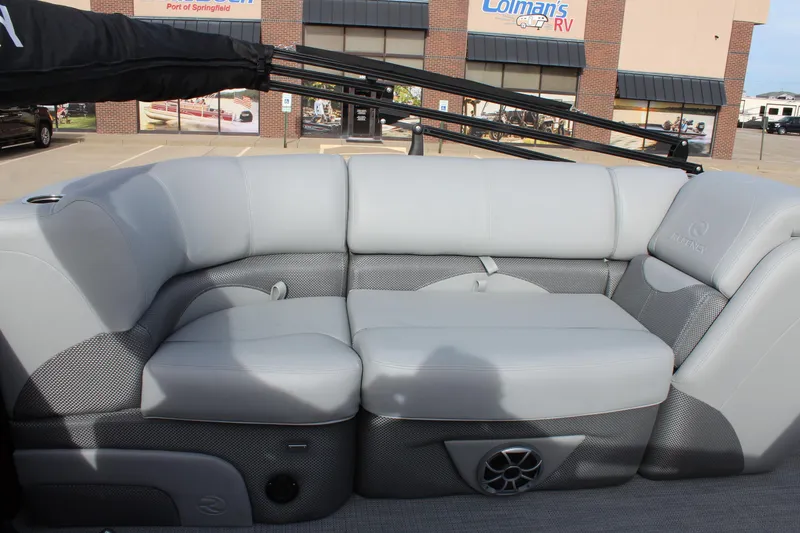 Slide: The Image of 2025 Regency 230 DL3 pontoon boat interior with luxurious gray seating and modern dashboard. - 8