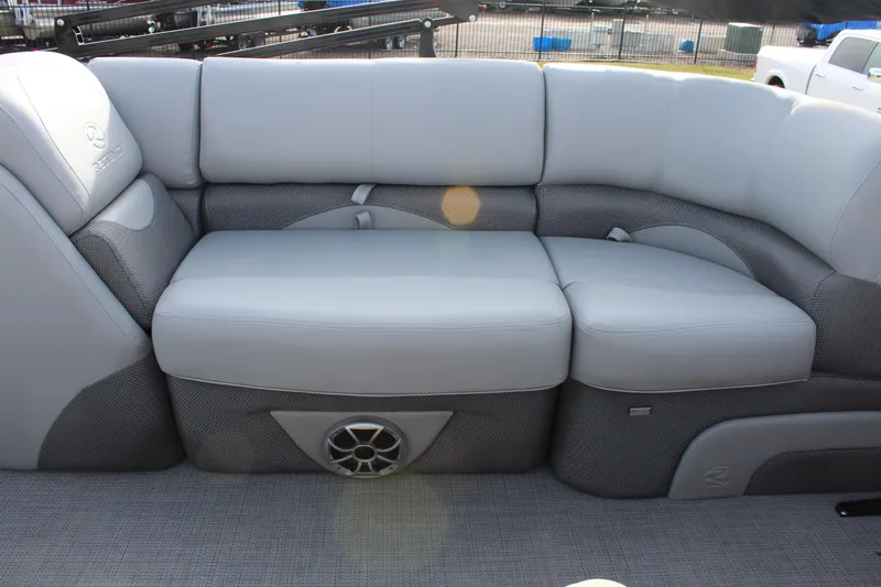 Slide: The Image of 2025 Regency 230 DL3 boat interior with gray cushioned seating. - 9