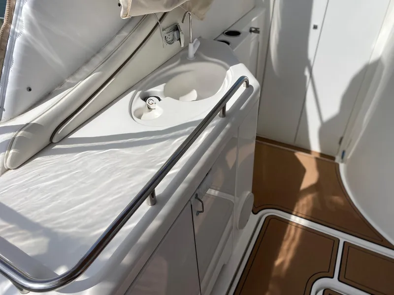 Slide: The Image of 2000 Cruisers 3672 yacht interior with sink and storage area. - 12