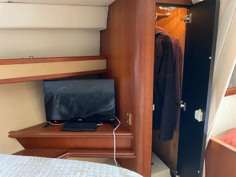 Slide: The Image of Interior of 2000 Cruisers 3672 yacht with TV and closet. - 24