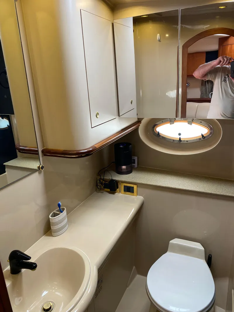 Slide: The Image of Bathroom interior of 2000 Cruisers 3672 yacht with sink, toilet, and mirror. - 27