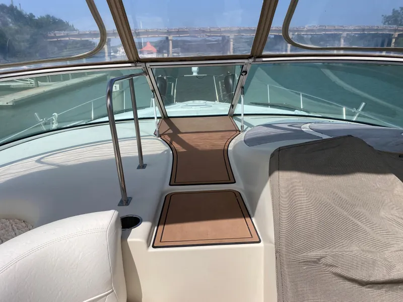 Slide: The Image of Cruisers 3672 yacht interior, 2000 model, featuring sleek design and spacious deck area. - 9