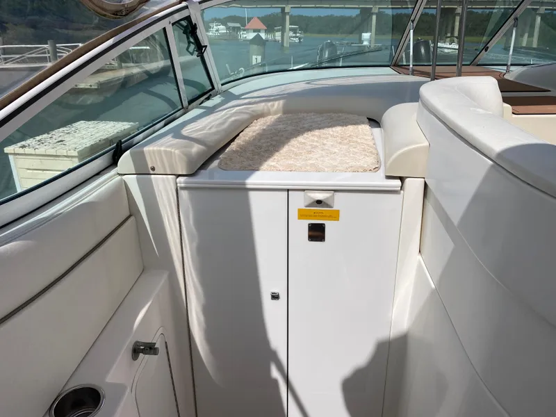 Slide: The Image of Interior of 2000 Cruisers 3672 yacht with white seating and storage compartment. - 19