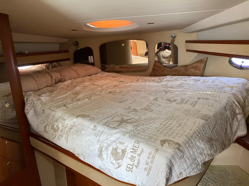 Slide: The Image of Luxurious cabin interior of 2000 Cruisers 3672 yacht with cozy bedding. - 23
