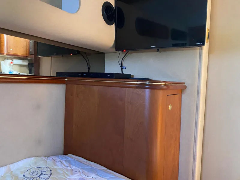 Slide: The Image of Interior of 2000 Cruisers 3672 yacht with TV and wooden cabinetry. - 26