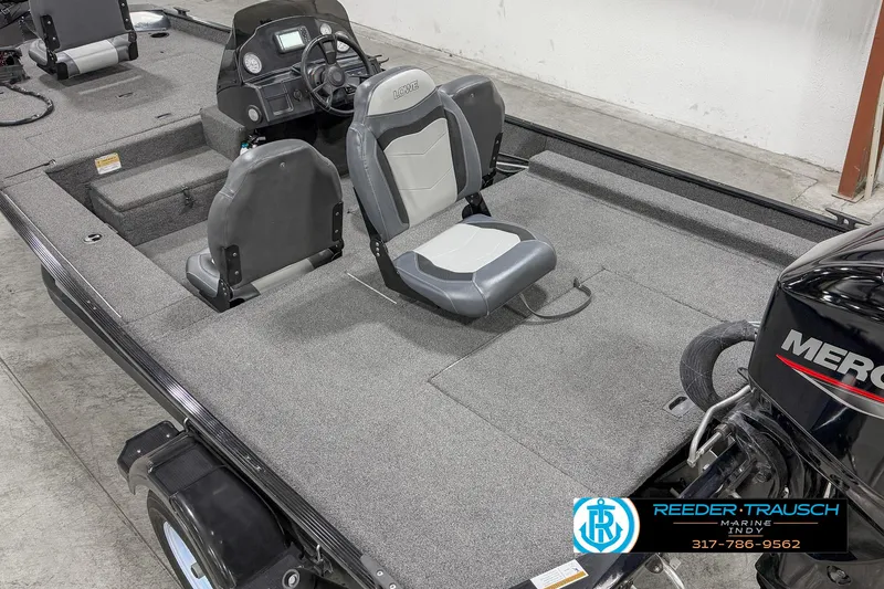 Slide: The Image of 2021 Lowe Skorpion 17 boat interior with seating and Mercury engine. - 10