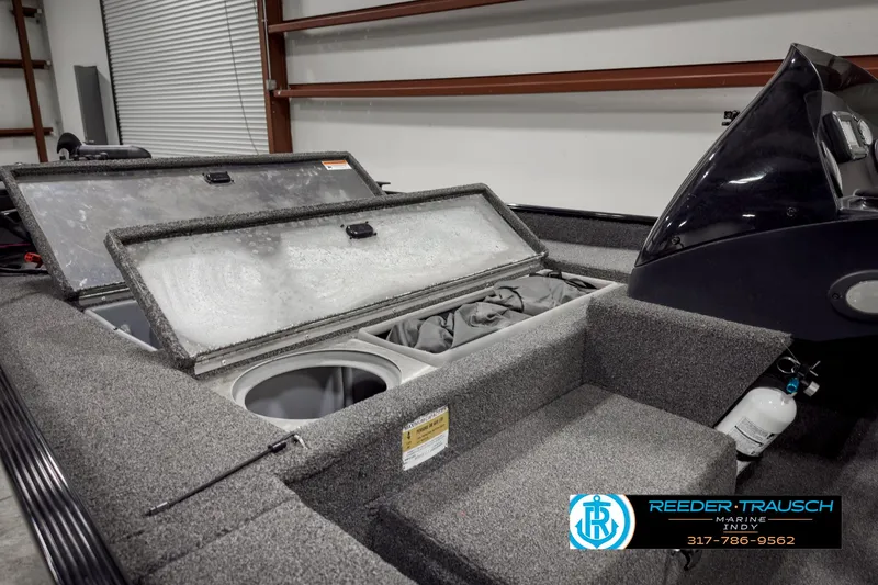 Slide: The Image of 2021 Lowe Skorpion 17 boat interior with open storage compartments. - 12