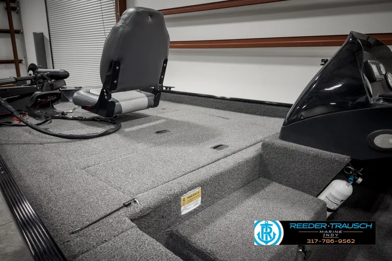 Slide: The Image of 2021 Lowe Skorpion 17 boat interior with seating and storage compartments. - 13