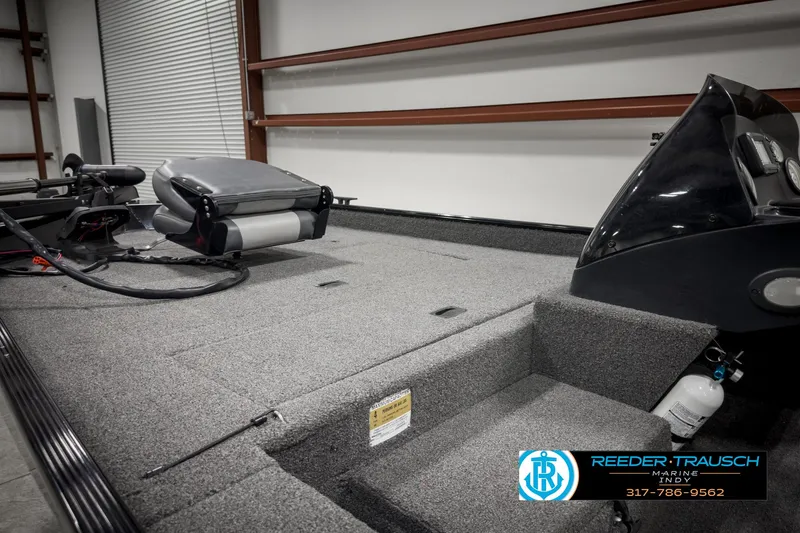 Slide: The Image of 2021 Lowe Skorpion 17 boat interior with carpeted deck and seating. - 14