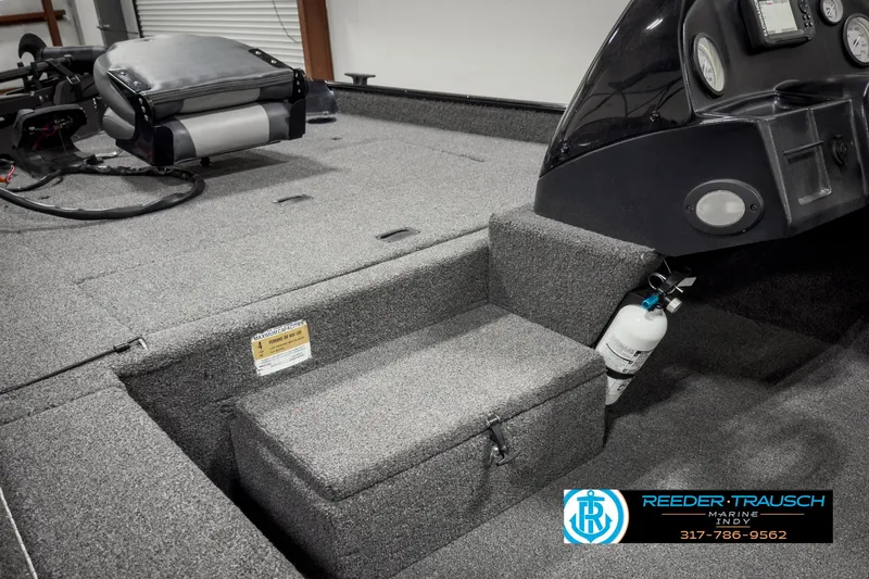 Slide: The Image of 2021 Lowe Skorpion 17 boat interior with seating and control panel. - 15