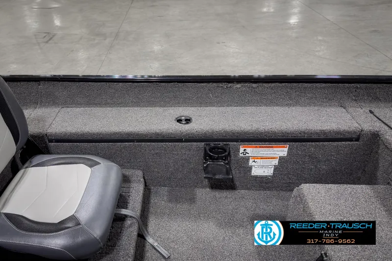Slide: The Image of 2021 Lowe Skorpion 17 boat interior with gray seating and storage compartment. - 17