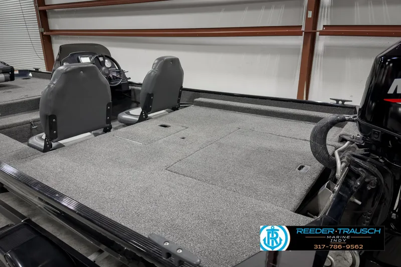 Slide: The Image of 2021 Lowe Skorpion 17 boat interior with dual seats and carpeted deck. - 19