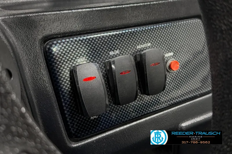 Slide: The Image of Control panel of 2021 Lowe Skorpion 17 boat with switches and horn button. - 29