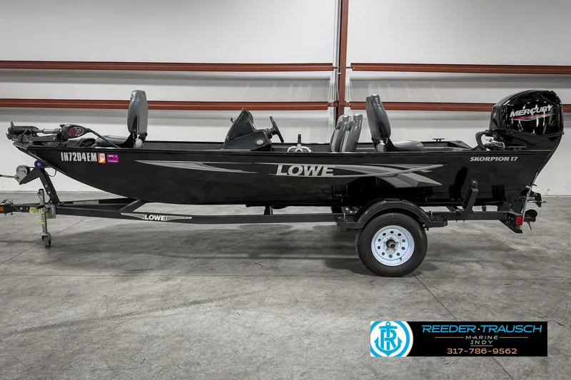 Slide: The Image of 2021 Lowe Skorpion 17 fishing boat with trailer in indoor showroom. - 3