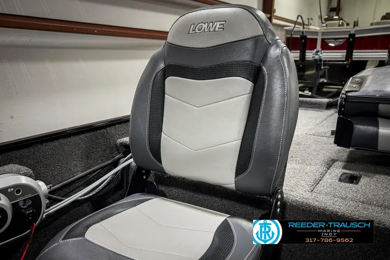 Slide: The Image of 2021 Lowe Skorpion 17 boat seat in a showroom setting. - 30