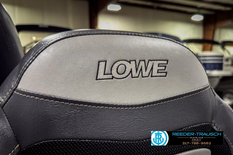 Slide: The Image of Close-up of 2021 Lowe Skorpion 17 boat seat with logo in showroom. - 31