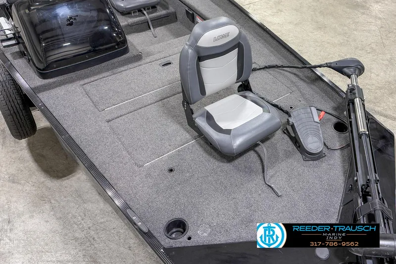 Slide: The Image of 2021 Lowe Skorpion 17 boat interior with gray seating and carpeted deck. - 8