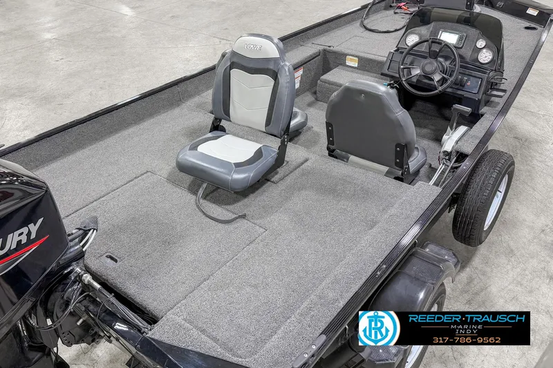 Slide: The Image of 2021 Lowe Skorpion 17 boat interior with seating and steering console. - 9