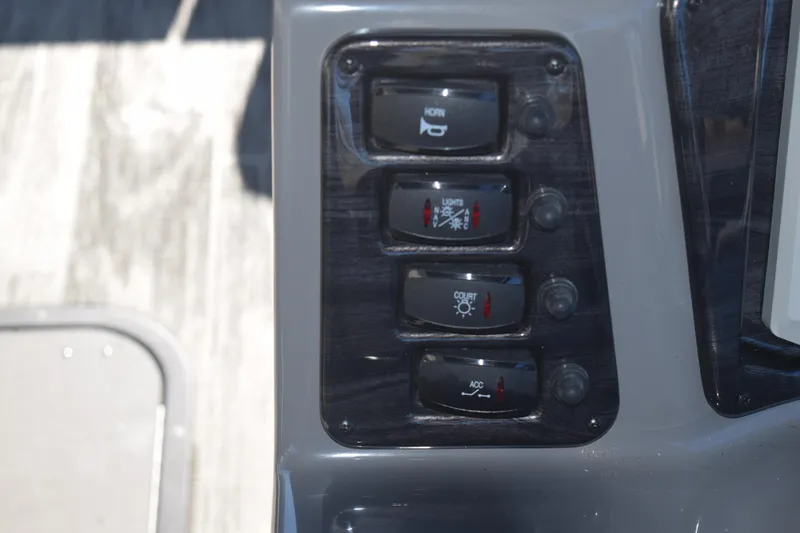 Slide: The Image of Control panel of 2025 Qwest E-Class 824 RLS with labeled switches. - 14