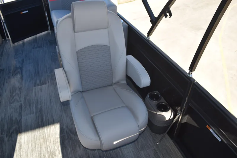 Slide: The Image of Luxurious seating in 2025 Qwest E-Class 824 RLS boat with cup holders and modern design. - 22