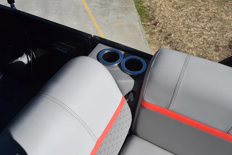 Slide: The Image of 2025 Qwest E-Class 824 RLS boat seating with cup holders, gray and red upholstery. - 23