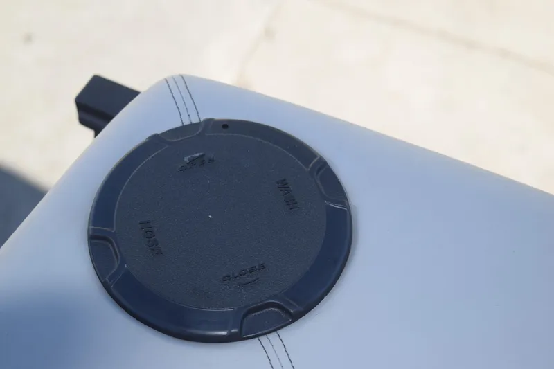 Slide: The Image of Close-up of a 2025 Qwest E-Class 824 RLS boat seat with a black circular detail. - 27