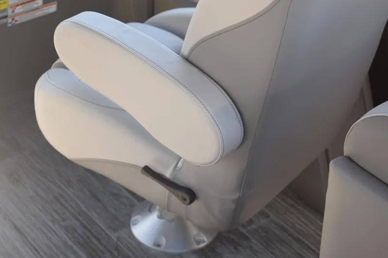 Slide: The Image of 2025 Qwest E-Class 824 RLS boat seat with armrest on wood flooring. - 29