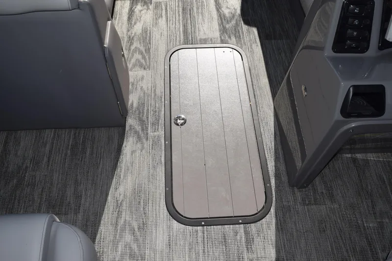 Slide: The Image of 2025 Qwest E-Class 824 RLS interior with sleek flooring and storage compartment. - 32