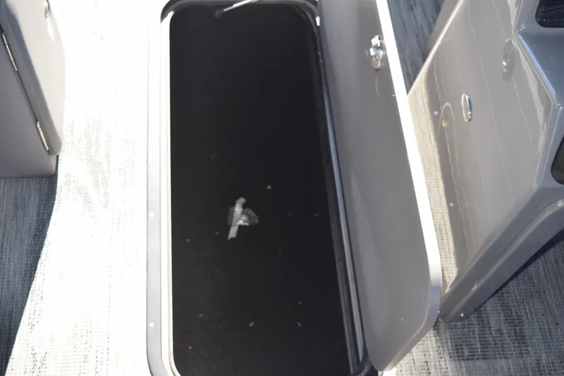 Slide: The Image of Open storage compartment in 2025 Qwest E-Class 824 RLS boat. - 33