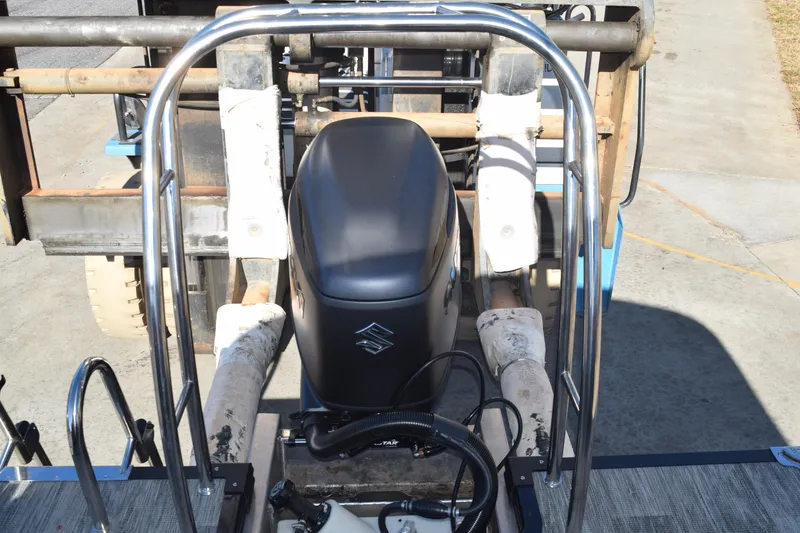 Slide: The Image of 2025 Qwest E-Class 824 RLS boat engine with protective railing on a trailer. - 35