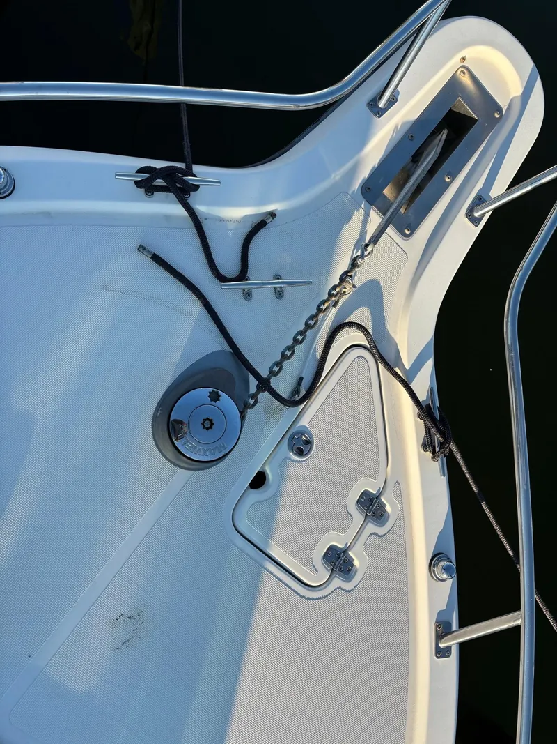 Slide: The Image of Close-up of 2003 Pursuit 2670 Denali LS boat deck with anchor chain and ropes. - 12