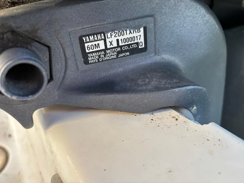 Slide: The Image of Close-up of Yamaha LF200TXRB engine label on 2003 Pursuit 2670 Denali LS boat. - 14