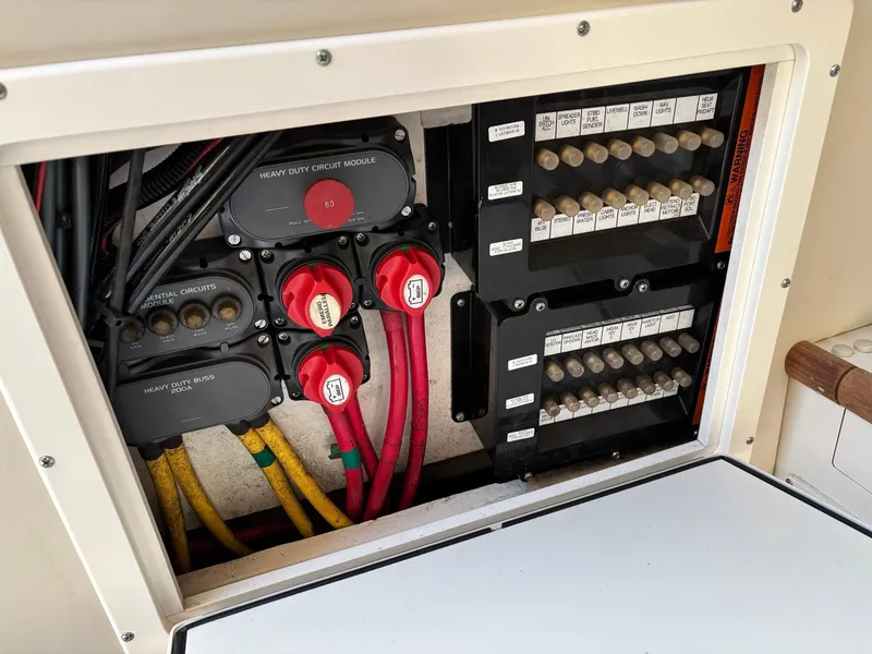 Slide: The Image of Electrical panel of 2003 Pursuit 2670 Denali LS boat with wiring and switches. - 19