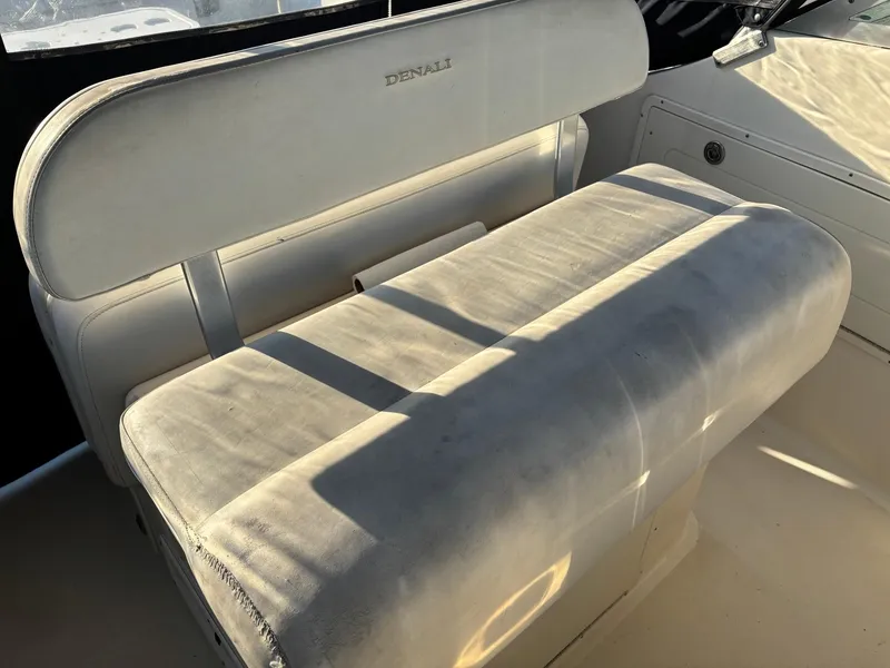 Slide: The Image of 2003 Pursuit 2670 Denali LS boat seat with sunlight and shadows. - 20