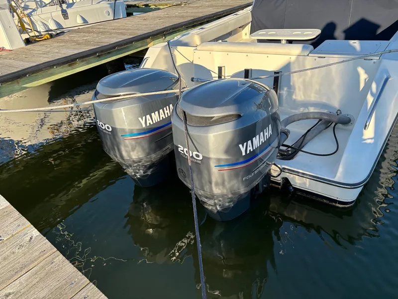 Slide: The Image of 2003 Pursuit 2670 Denali LS with twin Yamaha outboard engines docked. - 6