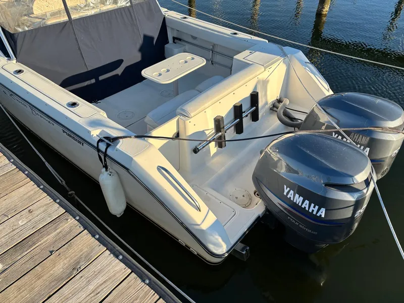 Slide: The Image of 2003 Pursuit 2670 Denali LS boat with Yamaha engines docked at marina. - 7